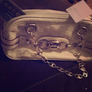 It’s a cream white Gucci Purse